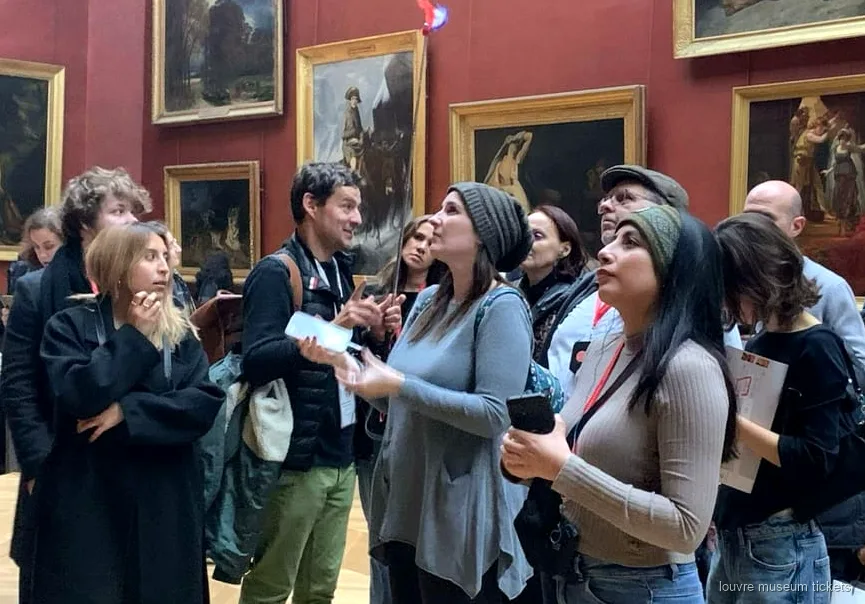 Small group of six guests on a guided Louvre Museum tour near the Venus de Milo